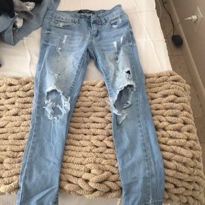 Light jeans with rips